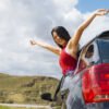 cheerful-young-female-car
