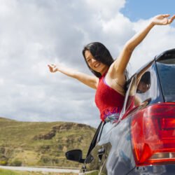 cheerful-young-female-car